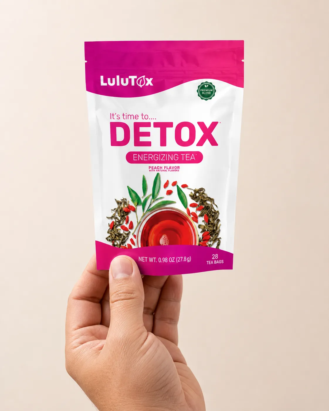 Lulutox Detox Tea HCTC — the package held in a hand
